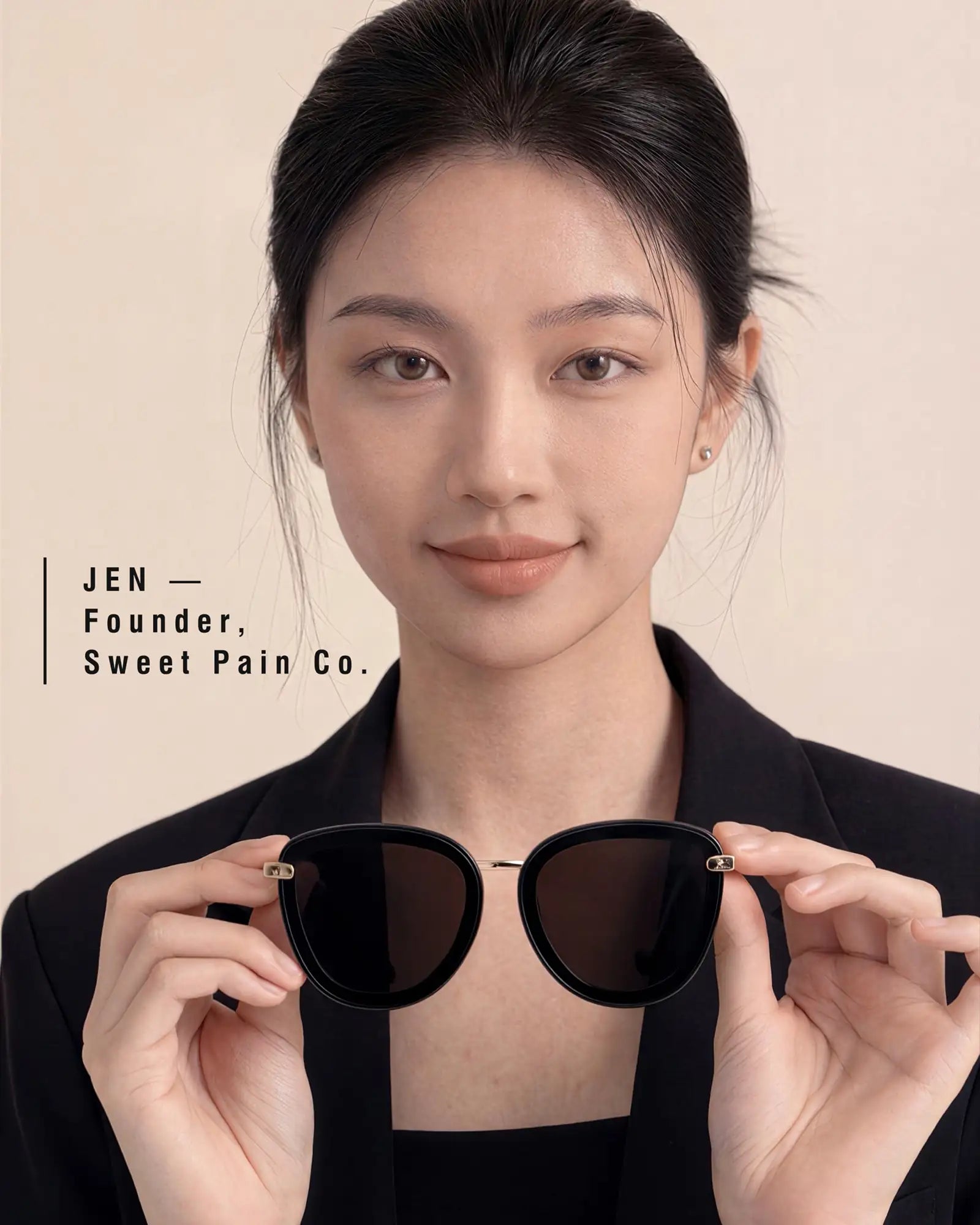 Jen, founder of Sweet Pain Co., holding JULIA sunglasses — Sweet Pain Fit Story