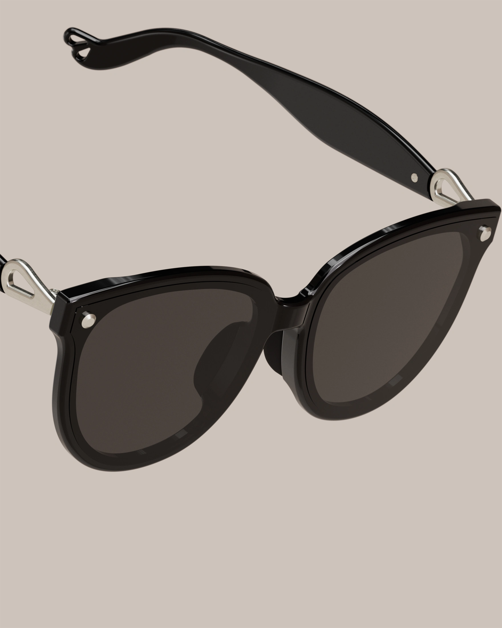 Sweet Pain NANA G1 sunglasses close-up showing edgeless rimless lens design in graphite