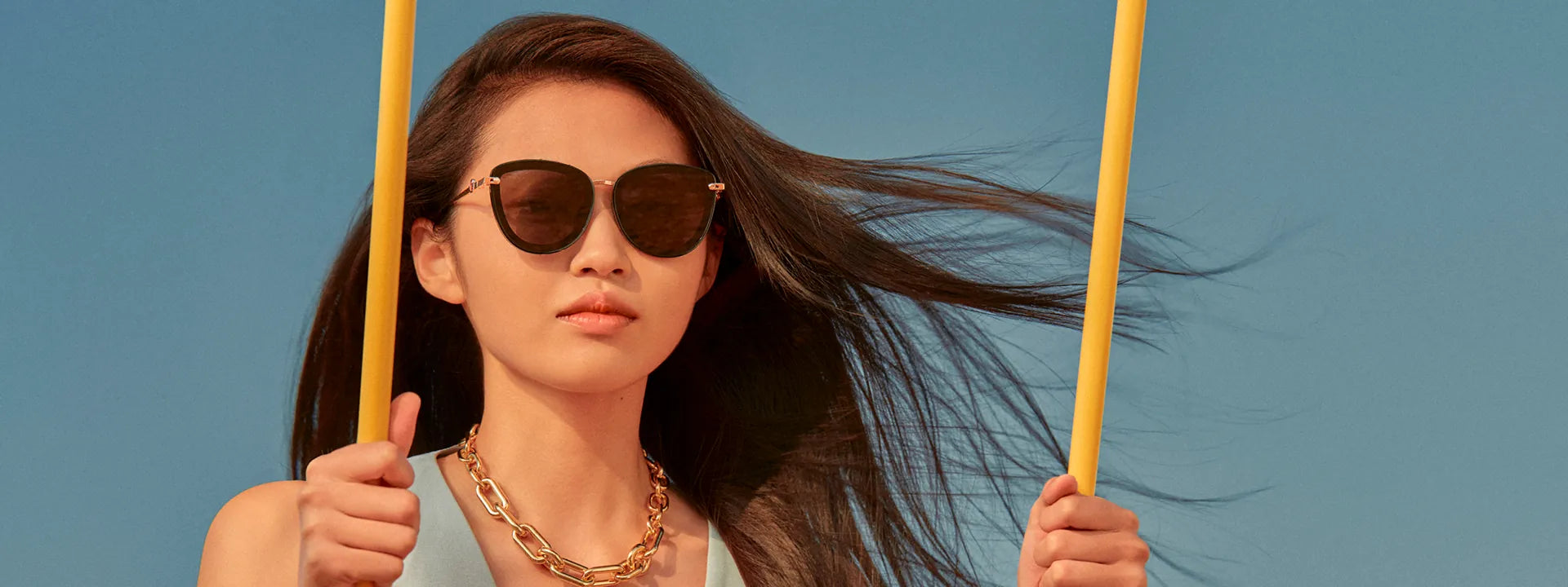 Woman wearing Sweet Pain JULIA G1 sunglasses in graphite, editorial campaign slide