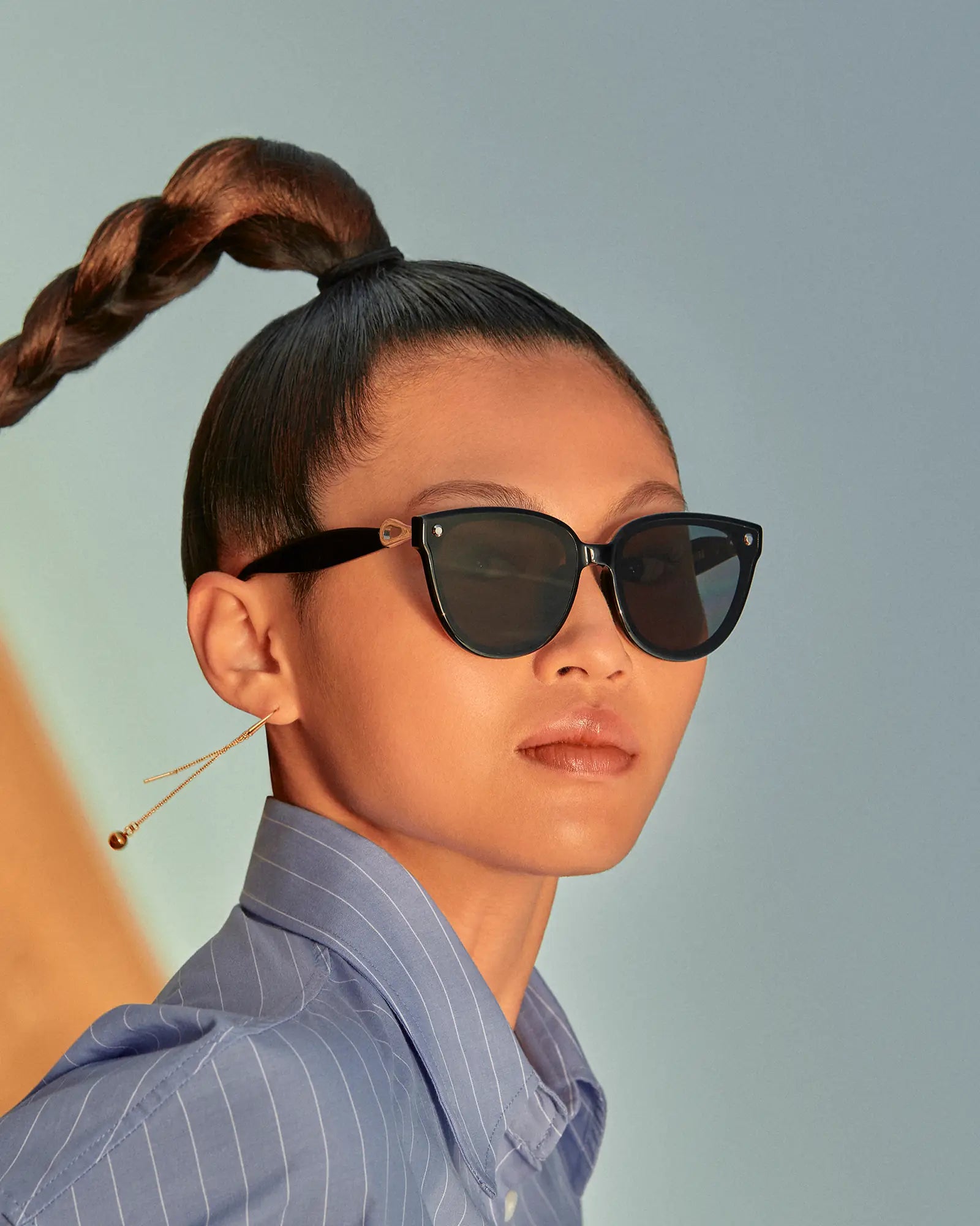 Woman wearing Sweet Pain NANA G1 sunglasses in graphite, editorial campaign shot