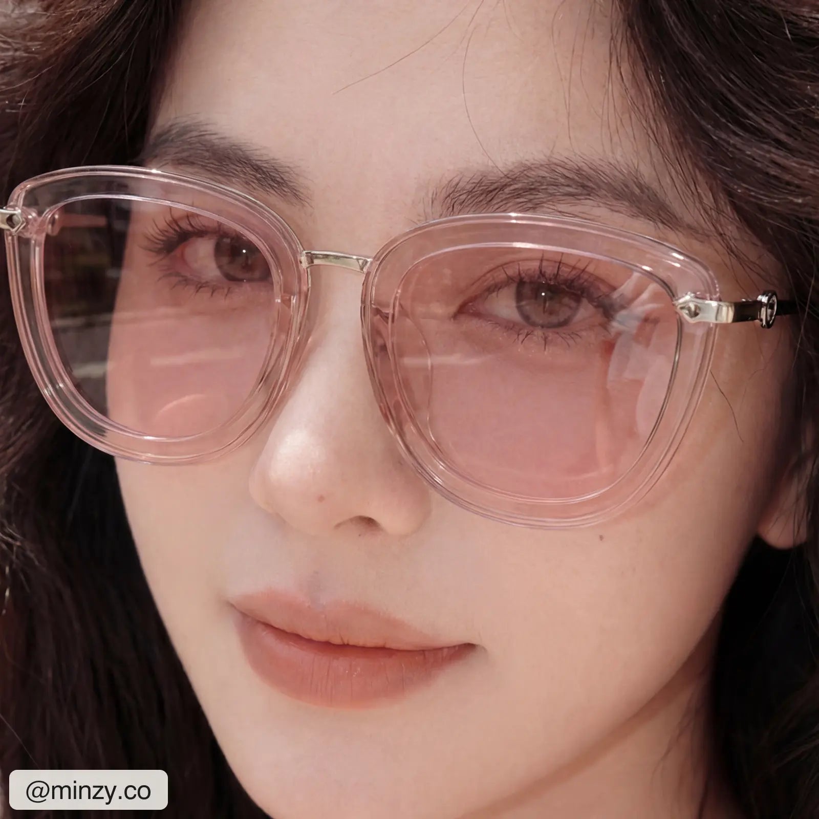 @minzy.co wearing Sweet Pain JULIA R1 sunglasses in rose, close-up portrait