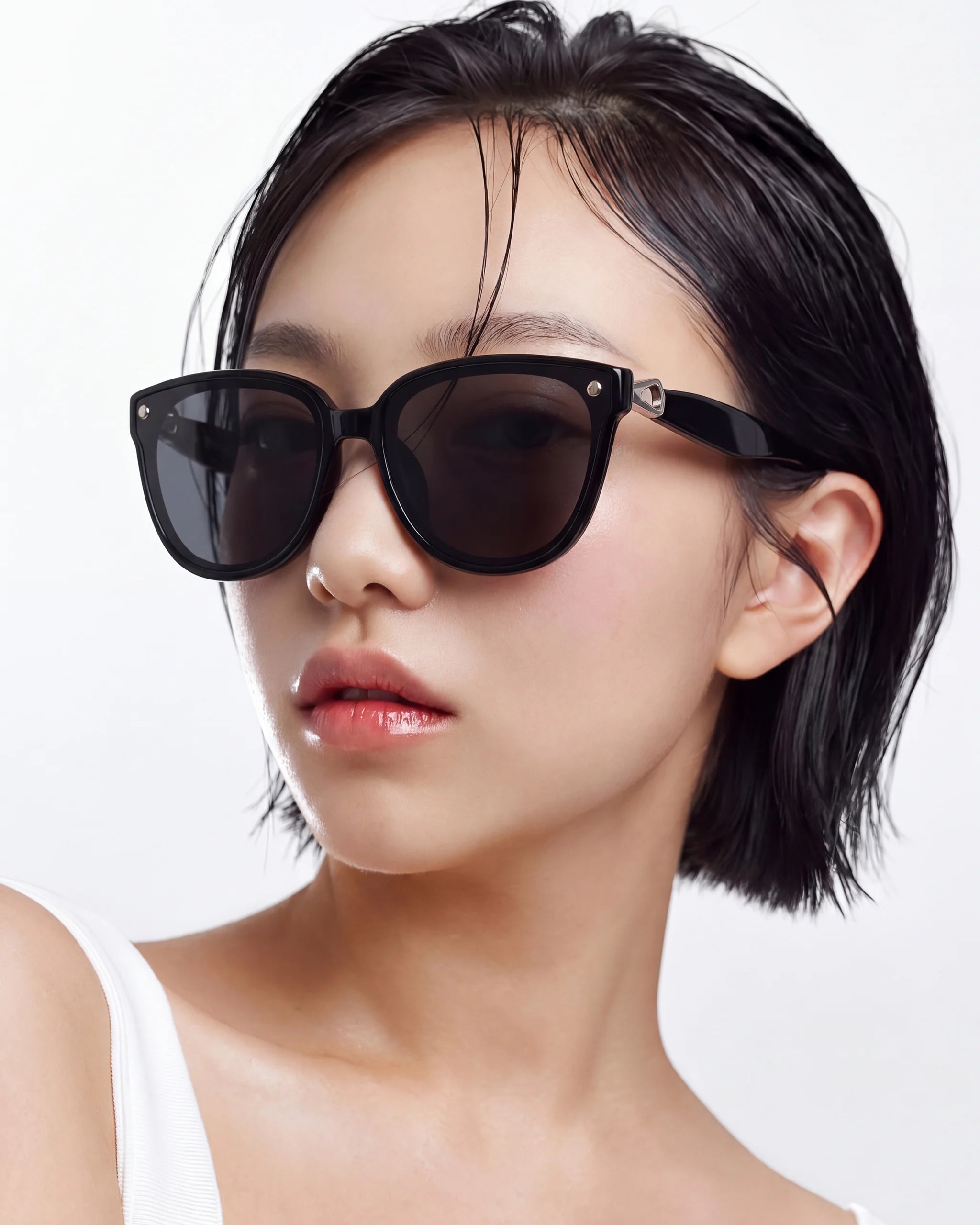 Sweet Pain NANA G1 sunglasses in glossy black worn by model, front-facing studio shot