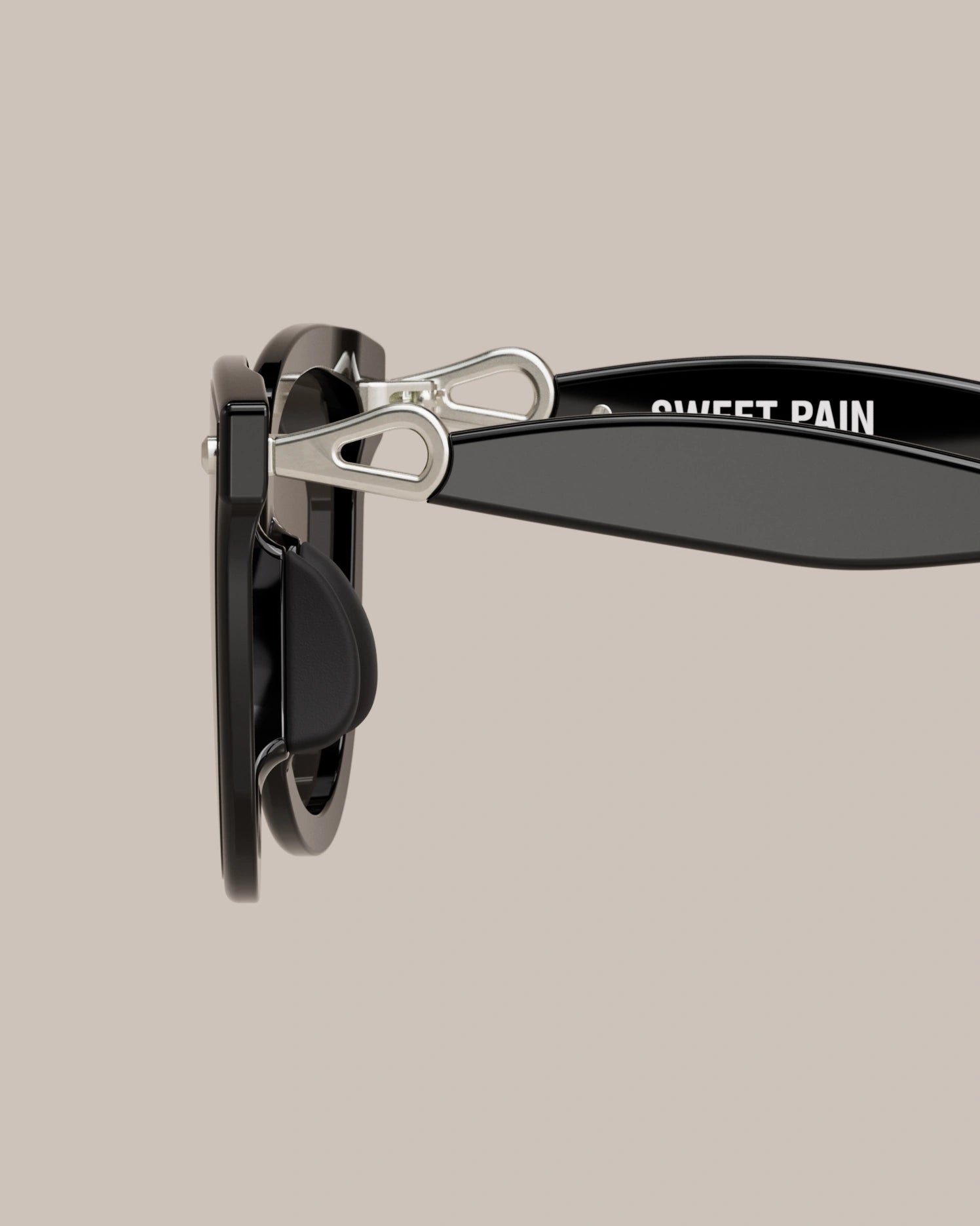 Sweet Pain NANA G1 sunglasses in glossy black with silver hinge, side angle product shot